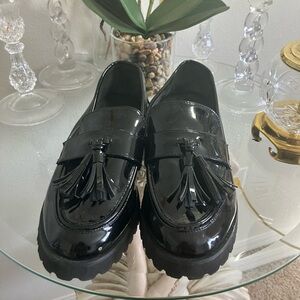 Black patent leather loafer